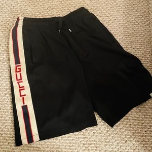 Gucci: Men’s Black Shorts with metal ties